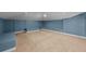 Finished basement provides extra space with carpet flooring and neutral walls at 2819 N Central Ave, Tampa, FL 33602