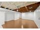 Unfinished basement with painted walls and sealed flooring offering flexible potential at 2819 N Central Ave, Tampa, FL 33602