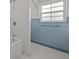 Bathroom with a tiled shower and blue tiled walls at 2819 N Central Ave, Tampa, FL 33602