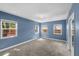 Spacious bedroom with carpet, multiple windows, and a closet at 2819 N Central Ave, Tampa, FL 33602