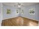 Bright bedroom featuring hardwood floors, neutral walls and multiple windows at 2819 N Central Ave, Tampa, FL 33602