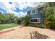 A view of the exterior of a well maintained home with brick driveway and beautiful landscaping at 2819 N Central Ave, Tampa, FL 33602