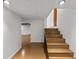 Basement hallway with stairs and access to lower level at 2819 N Central Ave, Tampa, FL 33602