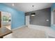 Kitchen area with gray accent wall, tile floors, and bench seating at 2819 N Central Ave, Tampa, FL 33602