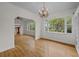 Bright living room featuring hardwood floors, chandelier, and an exterior view at 2819 N Central Ave, Tampa, FL 33602