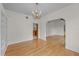 Bright living room featuring hardwood floors, chandelier, and archway to adjacent rooms at 2819 N Central Ave, Tampa, FL 33602