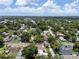 An aerial view shows the charming neighborhood filled with mature trees on a sunny day at 2819 N Central Ave, Tampa, FL 33602