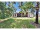 Lush backyard featuring the home's screened-in porch at 2823 Holly Bluff Ct, Plant City, FL 33566