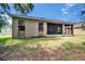 Spacious backyard with a view of the screened lanai at 2823 Holly Bluff Ct, Plant City, FL 33566
