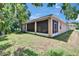 Exterior view of the home's screened porch and spacious backyard at 2823 Holly Bluff Ct, Plant City, FL 33566