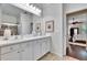 Bright primary bathroom featuring double sinks and a glass shower at 2823 Holly Bluff Ct, Plant City, FL 33566
