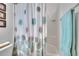 This bathroom features a shower with a decorative curtain and a built-in shelf at 2823 Holly Bluff Ct, Plant City, FL 33566