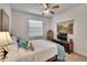 Inviting bedroom with a comfortable bed, window, and neutral decor at 2823 Holly Bluff Ct, Plant City, FL 33566