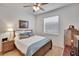 Comfortable bedroom with a plush bed and natural light from the window at 2823 Holly Bluff Ct, Plant City, FL 33566