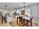 Dining area located adjacent to the kitchen featuring modern chandelier and ample natural light at 2823 Holly Bluff Ct, Plant City, FL 33566