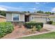 Charming single-story home with a well-maintained lawn, front garden, and two-car garage at 2823 Holly Bluff Ct, Plant City, FL 33566