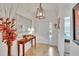 Foyer with tile floors, console table, mirror, and view into the home at 2823 Holly Bluff Ct, Plant City, FL 33566