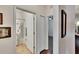 Hallway view of bathroom and bedroom highlighting the home's layout at 2823 Holly Bluff Ct, Plant City, FL 33566