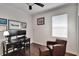 The home office features hardwood floors, a ceiling fan, and a comfortable leather chair at 2823 Holly Bluff Ct, Plant City, FL 33566