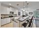 Bright and modern kitchen with breakfast bar and stainless steel appliances at 2823 Holly Bluff Ct, Plant City, FL 33566
