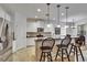 Kitchen with breakfast bar offers seamless flow to dining area, ideal for modern living at 2823 Holly Bluff Ct, Plant City, FL 33566