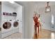 Convenient laundry room featuring modern front-loading washer and dryer at 2823 Holly Bluff Ct, Plant City, FL 33566