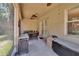 Cozy screened porch with backyard access and exterior storage at 2823 Holly Bluff Ct, Plant City, FL 33566