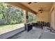 Inviting screened porch with a view of the serene backyard at 2823 Holly Bluff Ct, Plant City, FL 33566
