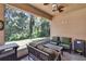 Relaxing screened porch offering views of the lush, green backyard at 2823 Holly Bluff Ct, Plant City, FL 33566