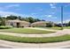 A street view showcases similar single-story homes with well-kept lawns and landscaping at 2823 Holly Bluff Ct, Plant City, FL 33566