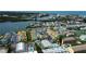 An aerial view of colorful waterfront condos, boat docks, and community pool at 318 Windrush Blvd # 10, Indian Rocks Beach, FL 33785