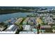 An aerial view of colorful waterfront condos, boat docks, and community pool at 318 Windrush Blvd # 10, Indian Rocks Beach, FL 33785