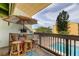 Balcony bar with stools offers an inviting space to enjoy the pool views and sunny weather at 318 Windrush Blvd # 10, Indian Rocks Beach, FL 33785