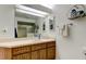 Bright bathroom featuring a shower and bath with vanity and sink at 318 Windrush Blvd # 10, Indian Rocks Beach, FL 33785