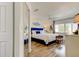 Bedroom features a large window, wood floors, closet and a mirrored closet door at 318 Windrush Blvd # 10, Indian Rocks Beach, FL 33785