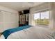 Bright bedroom with hardwood floors, a ceiling fan, and natural lighting at 318 Windrush Blvd # 10, Indian Rocks Beach, FL 33785
