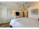 Comfortable bedroom featuring wood floors and a ceiling fan at 318 Windrush Blvd # 10, Indian Rocks Beach, FL 33785