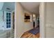 Hallway features views of the kitchen and dining room with stylish flooring and ample closet space at 318 Windrush Blvd # 10, Indian Rocks Beach, FL 33785