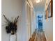 Hallway with closet space leading to a room with a beach-themed decor at 318 Windrush Blvd # 10, Indian Rocks Beach, FL 33785