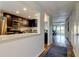 Modern kitchen with stainless steel appliances, quartz countertops, and view to living room at 318 Windrush Blvd # 10, Indian Rocks Beach, FL 33785
