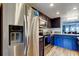 Bright kitchen features stainless steel appliances, and two-tone cabinets with light countertops at 318 Windrush Blvd # 10, Indian Rocks Beach, FL 33785