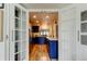 Elegant kitchen features a passthrough, modern appliances, and stylish cabinetry at 318 Windrush Blvd # 10, Indian Rocks Beach, FL 33785