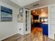 Open view from the office to the kitchen featuring stainless steel appliances and dark cabinets at 318 Windrush Blvd # 10, Indian Rocks Beach, FL 33785