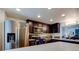 Modern kitchen with stainless steel appliances, two-tone cabinets, and quartz countertops at 318 Windrush Blvd # 10, Indian Rocks Beach, FL 33785