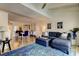 Open floor plan with living room and dining area with hardwood floors and natural light at 318 Windrush Blvd # 10, Indian Rocks Beach, FL 33785