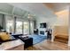 Stylish living room with white ceilings, a fireplace, a TV, and sliding doors opening to a scenic balcony at 318 Windrush Blvd # 10, Indian Rocks Beach, FL 33785