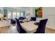 Bright and airy living space, open to the dining area, with deck access and serene views at 318 Windrush Blvd # 10, Indian Rocks Beach, FL 33785