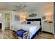 Spacious bedroom featuring wood floors, ceiling fan, and ample natural light at 318 Windrush Blvd # 10, Indian Rocks Beach, FL 33785