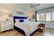 Comfortable bedroom with wood floors, ceiling fan, and plenty of natural light at 318 Windrush Blvd # 10, Indian Rocks Beach, FL 33785