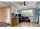 Office with large windows, ceiling fan, and desk with blue rug at 318 Windrush Blvd # 10, Indian Rocks Beach, FL 33785